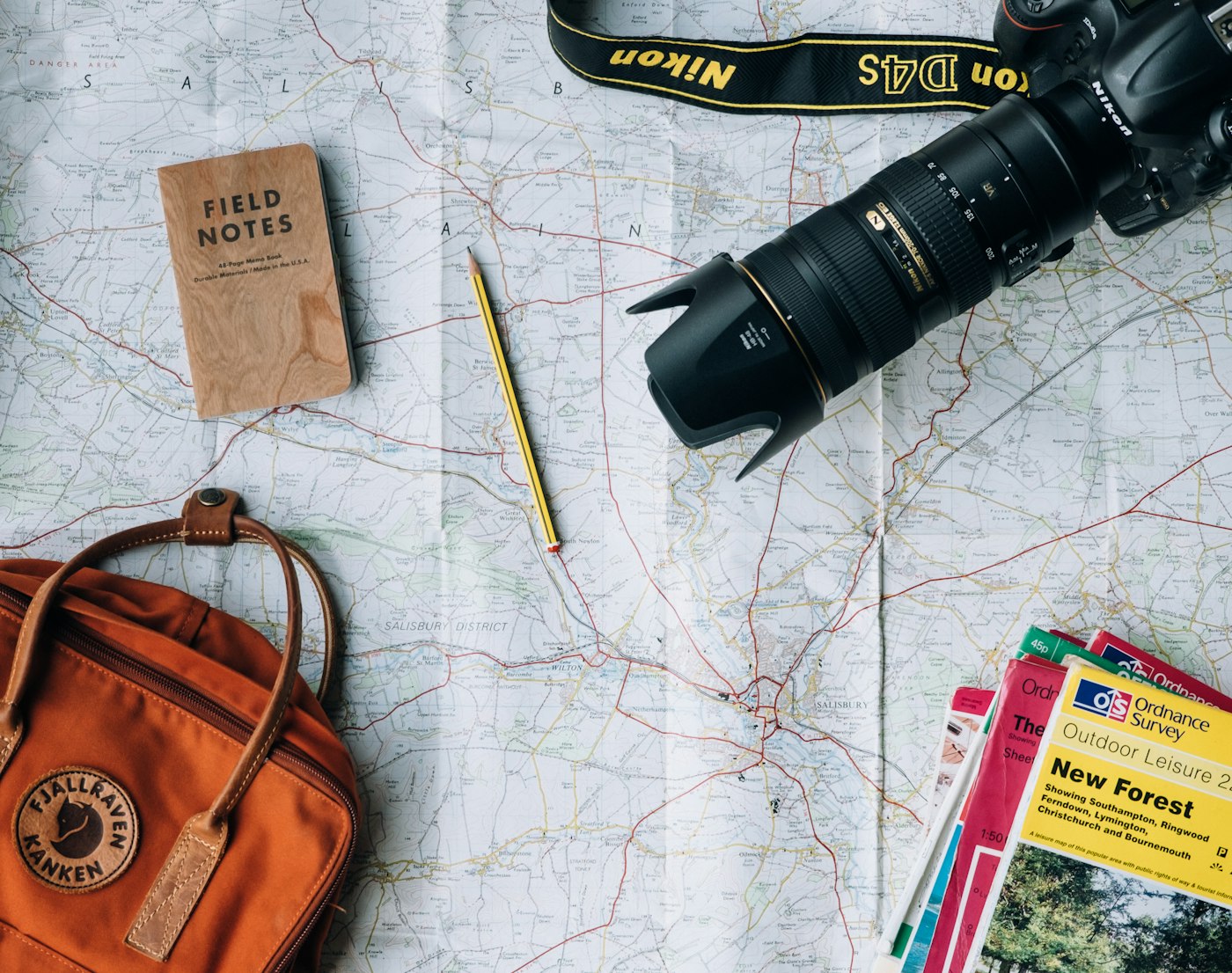 Travellers with maps and a camera